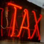 Neon sign that says TAX