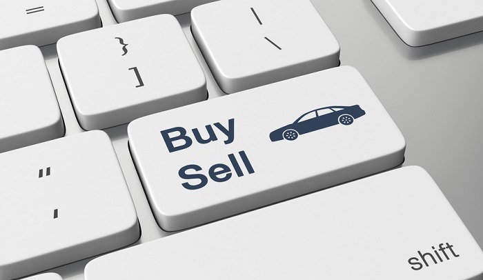 Keyboard with a button representing buying or selling a car